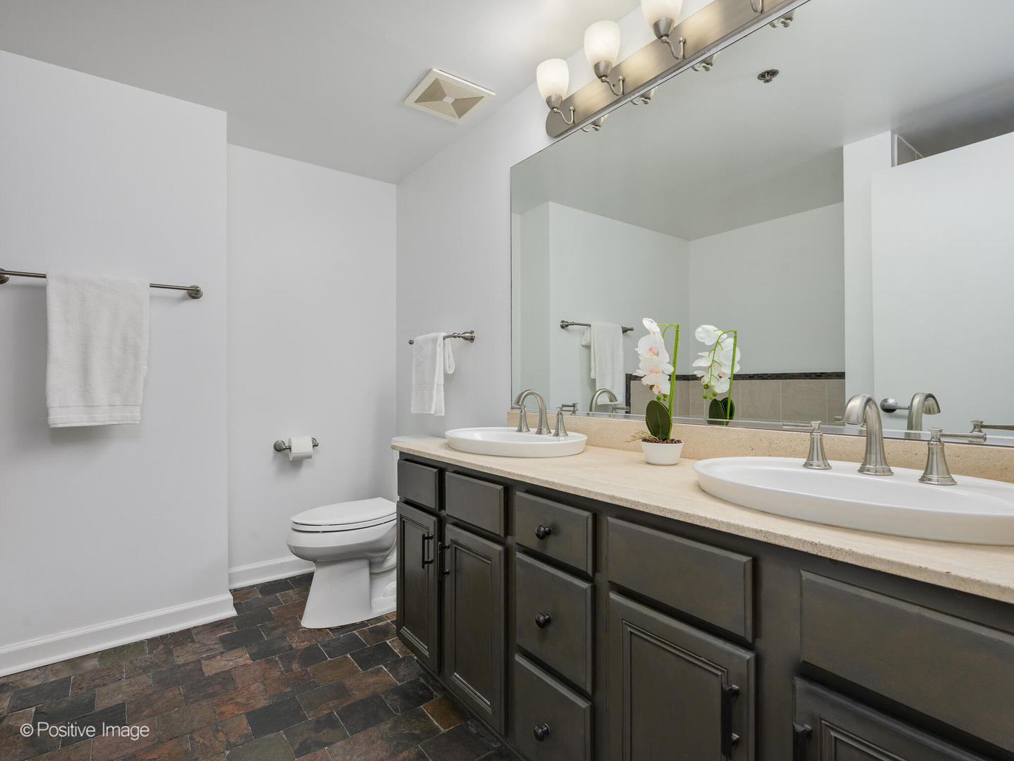5 East 14th Place, Unit 501 Chicago, IL 60605 - Photo 14 of 26 a bathroom with a double vanity sink toilet and a mirror