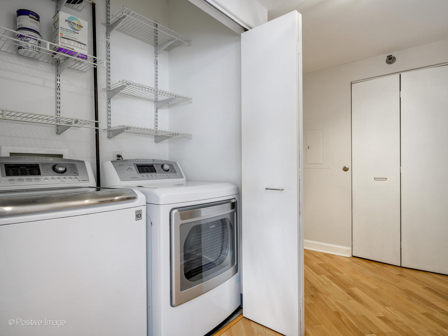 5 East 14th Place, Unit 501 Chicago, IL 60605 - Photo 18 of 26 a view of a storage and utility room with washer and dryer