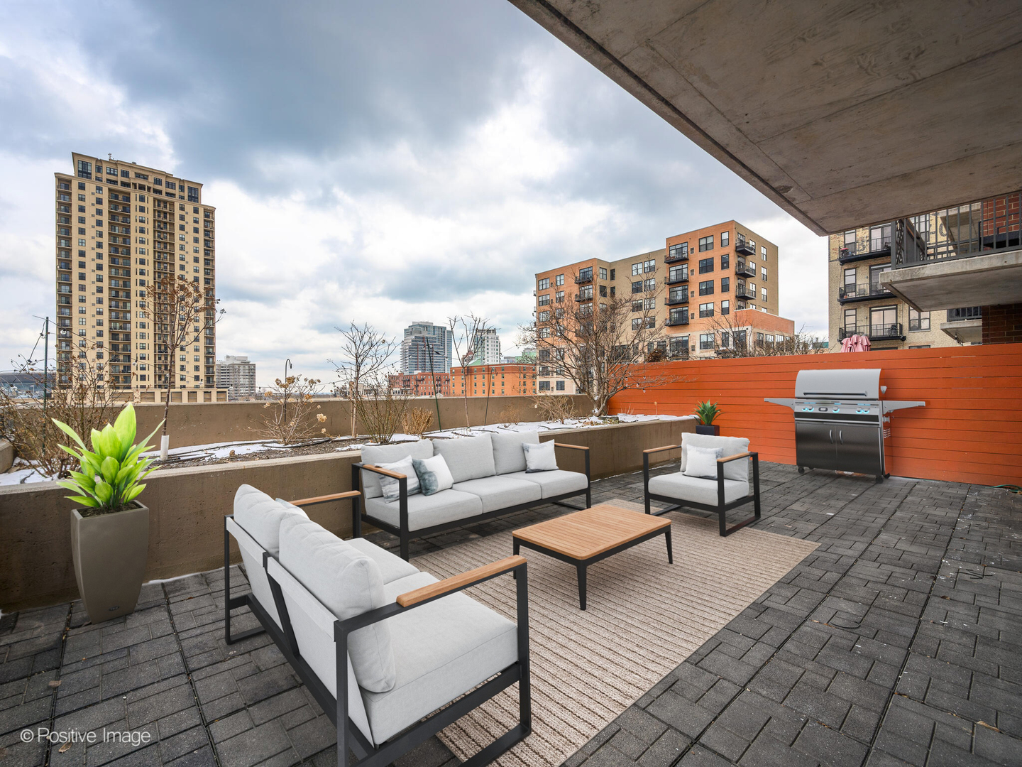 5 East 14th Place, Unit 501 Chicago, IL 60605 - Photo 20 of 26 a outdoor living space with patio furniture and a potted plant