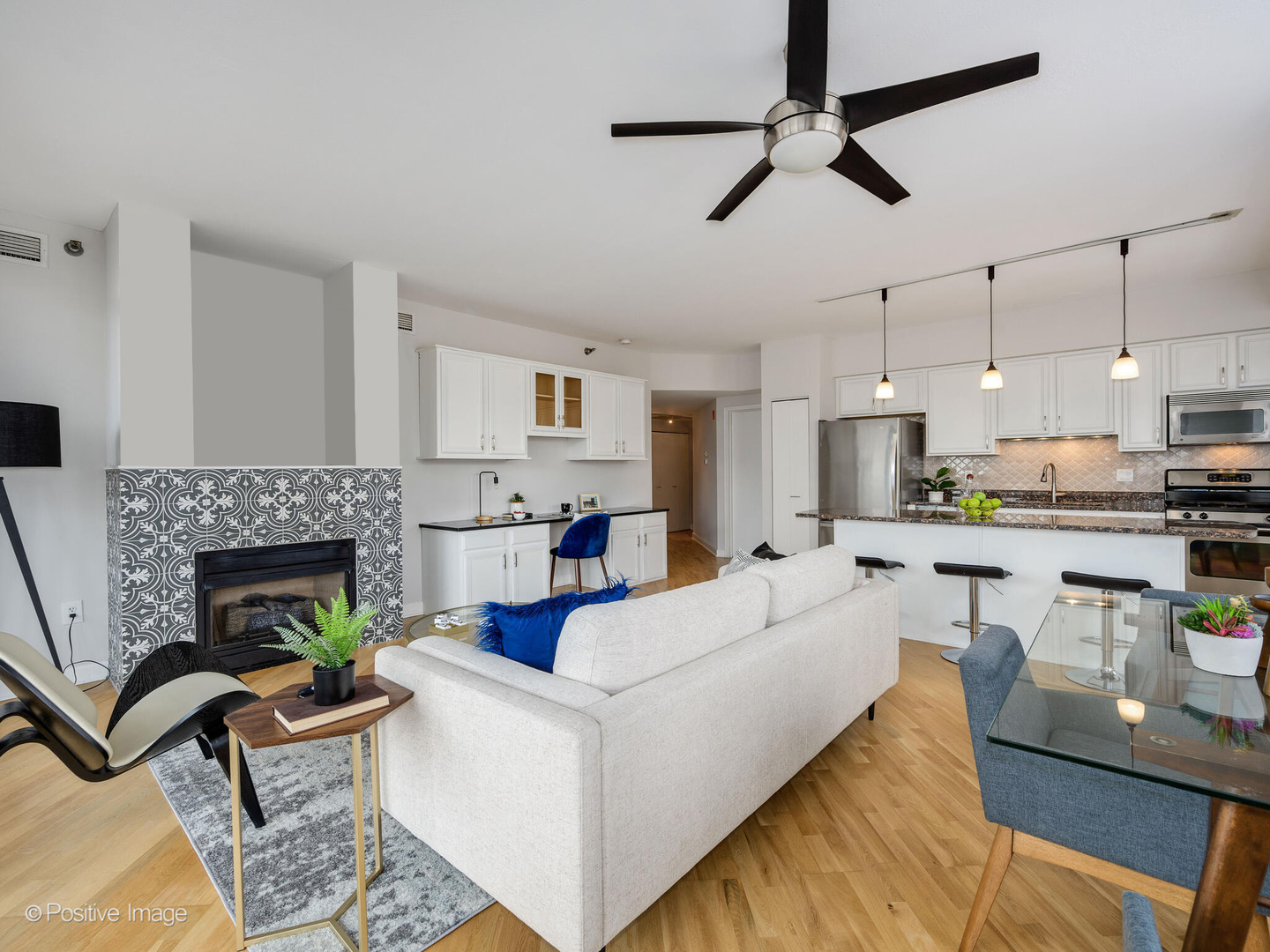 5 East 14th Place, Unit 501 Chicago, IL 60605 - Photo 6 of 26 a living room with furniture fireplace and a window