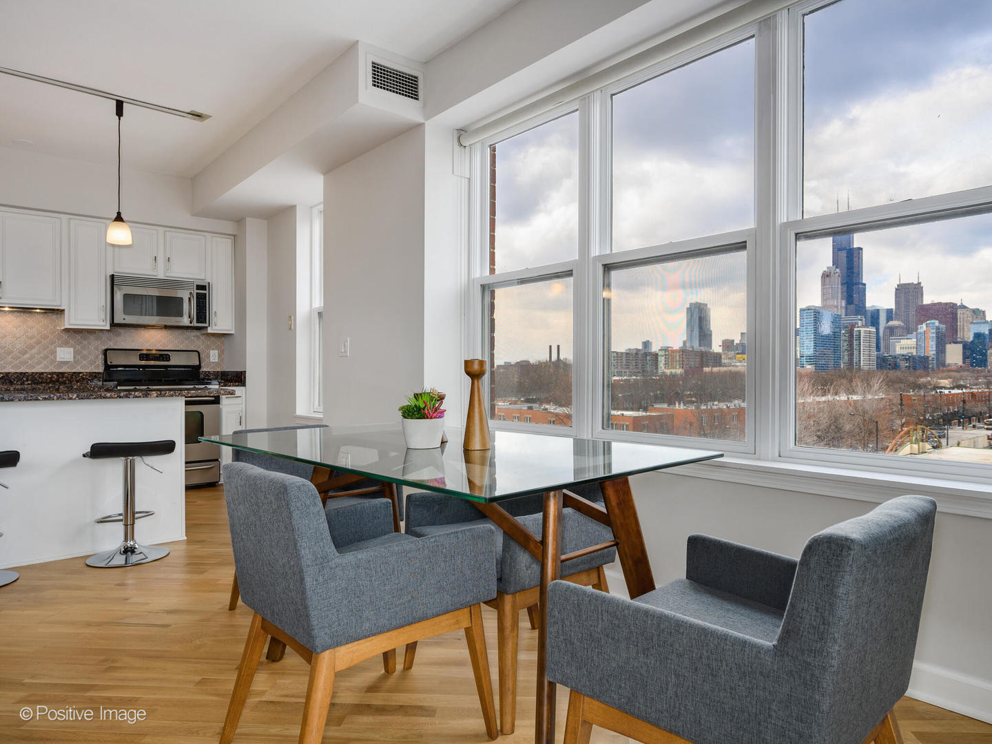 5 East 14th Place, Unit 501 Chicago, IL 60605 - Photo 10 of 26 a view of a dining room with furniture window and outside view