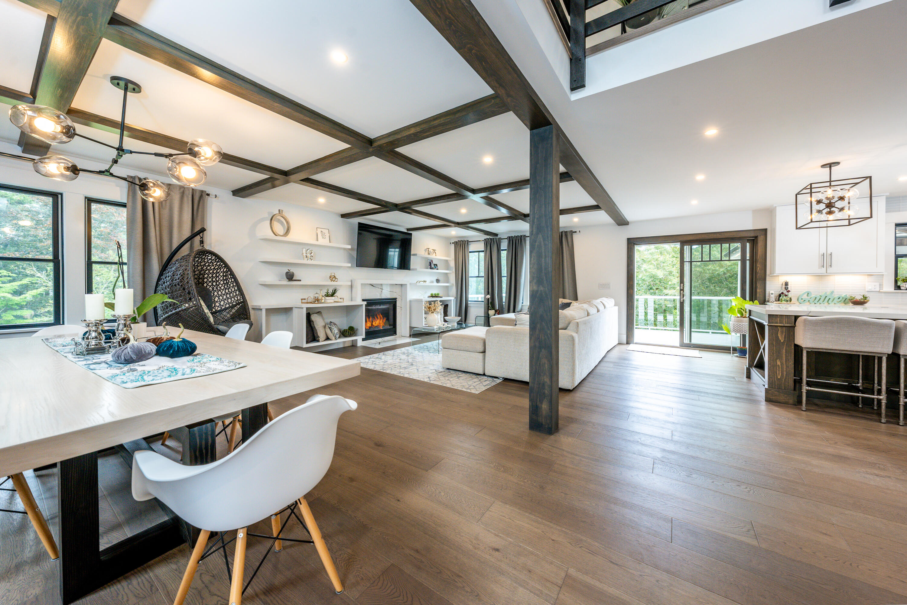 180 Kettle Hole Road West Barnstable, MA 02668 - Photo 16 of 53 a view of a dining room with furniture a chandelier and wooden floor