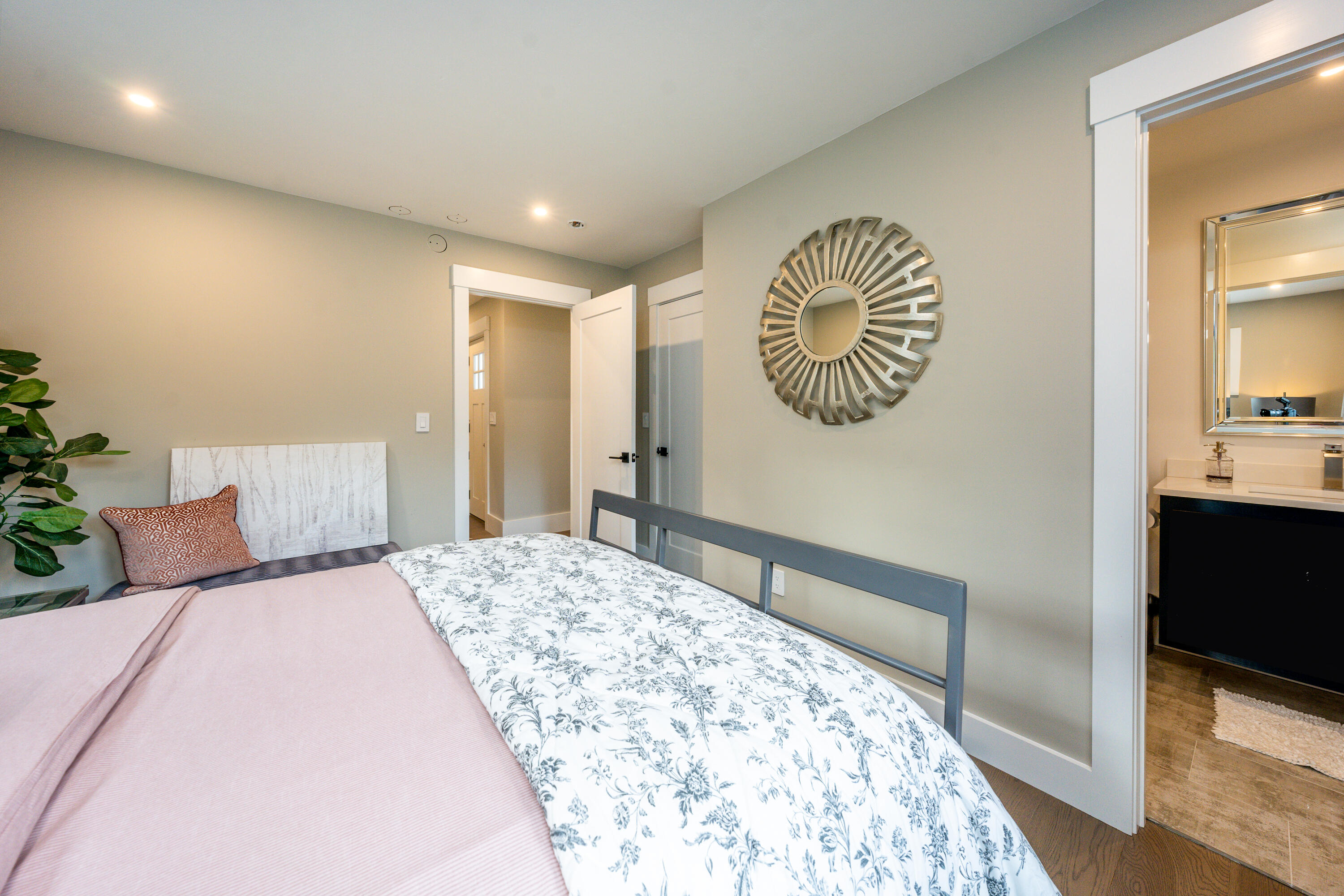 180 Kettle Hole Road West Barnstable, MA 02668 - Photo 20 of 53 a bedroom with a large bed and a chandelier