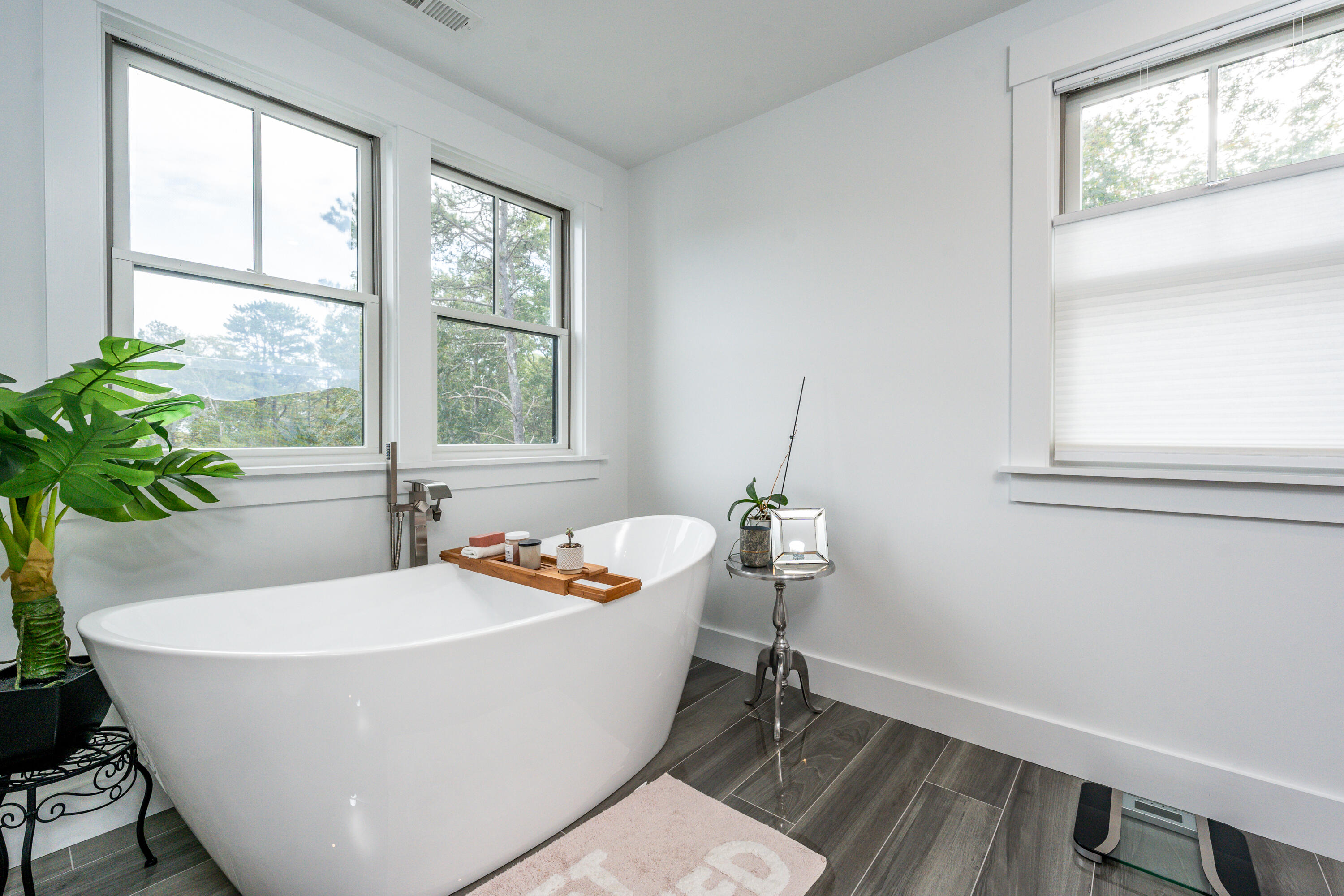 180 Kettle Hole Road West Barnstable, MA 02668 - Photo 35 of 53 a white bath tub sitting in a bathroom next to a window