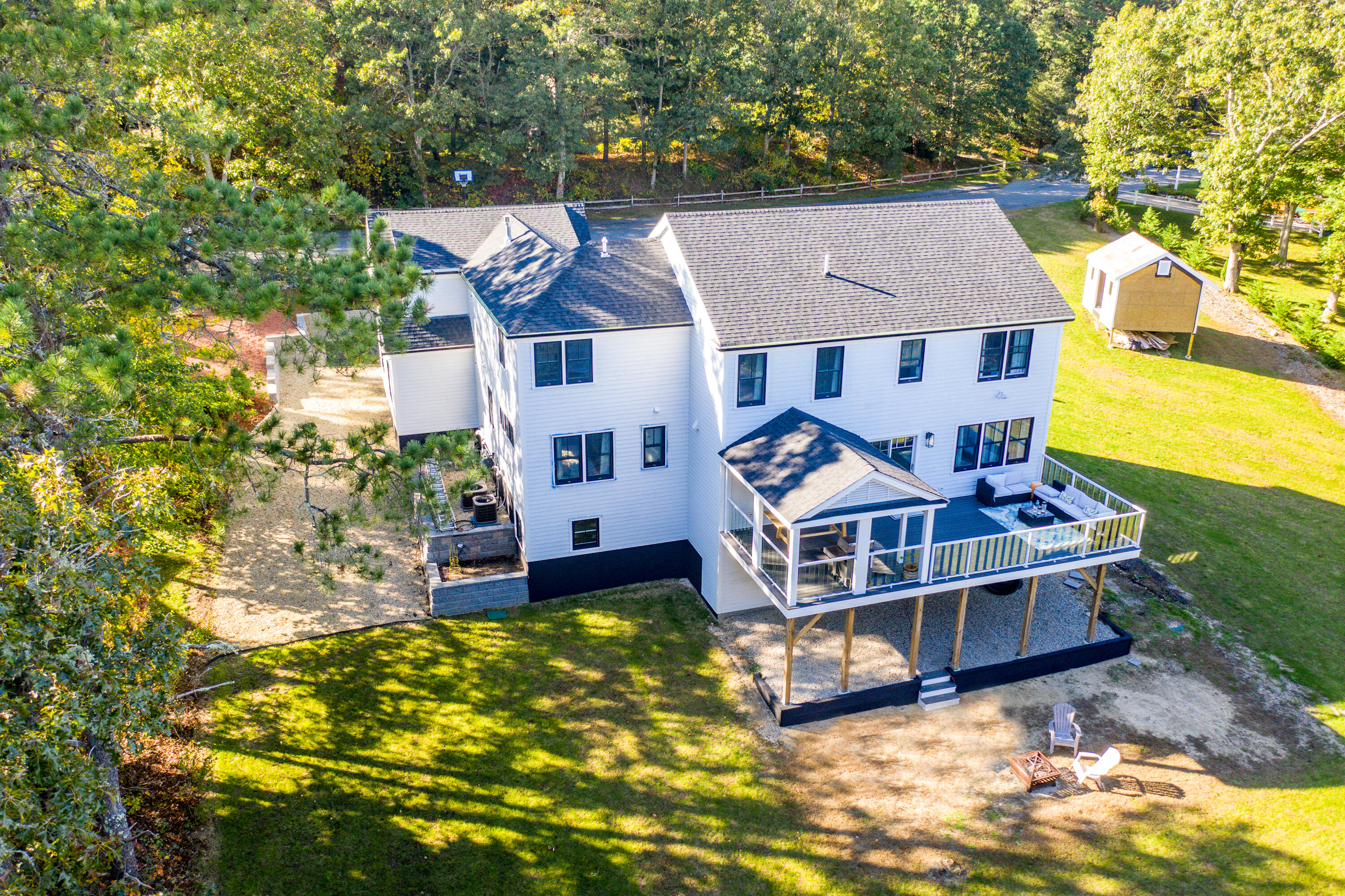 180 Kettle Hole Road West Barnstable, MA 02668 - Photo 48 of 53 an aerial view of a house with a big yard and large trees