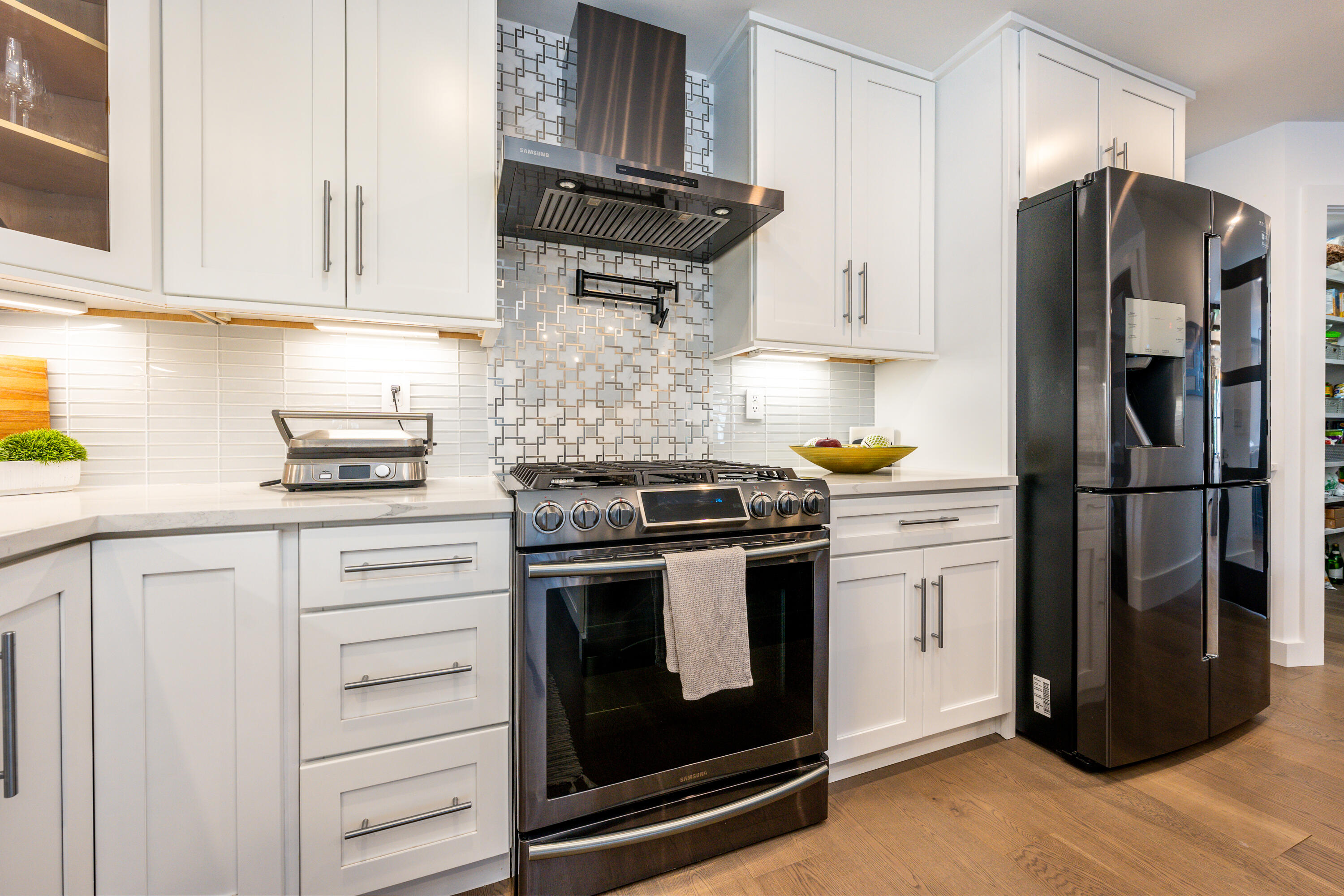 180 Kettle Hole Road West Barnstable, MA 02668 - Photo 6 of 53 a kitchen with stainless steel appliances white cabinets and a refrigerator