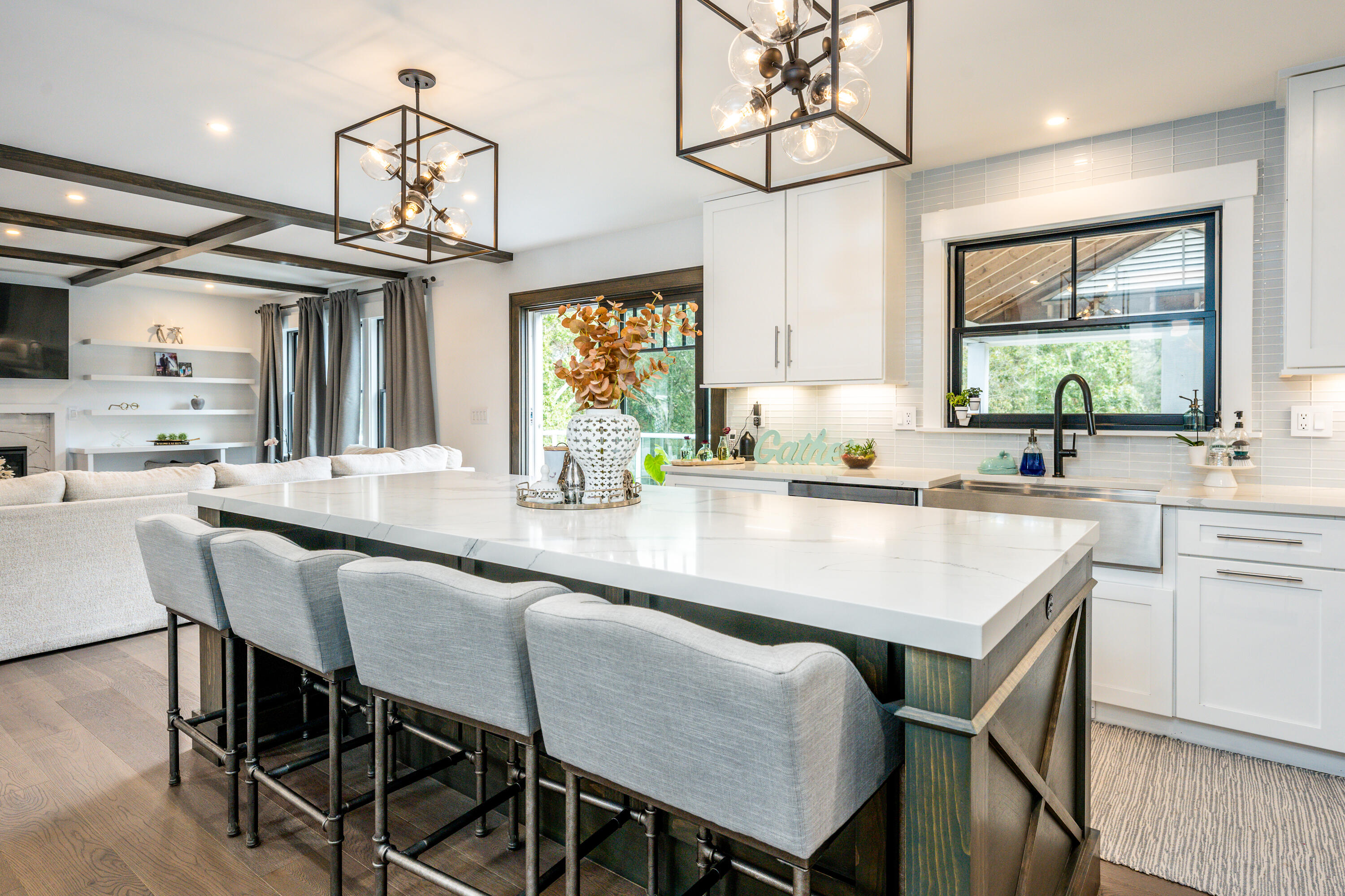 180 Kettle Hole Road West Barnstable, MA 02668 - Photo 8 of 53 a kitchen with a dining table chairs sink and wooden floor
