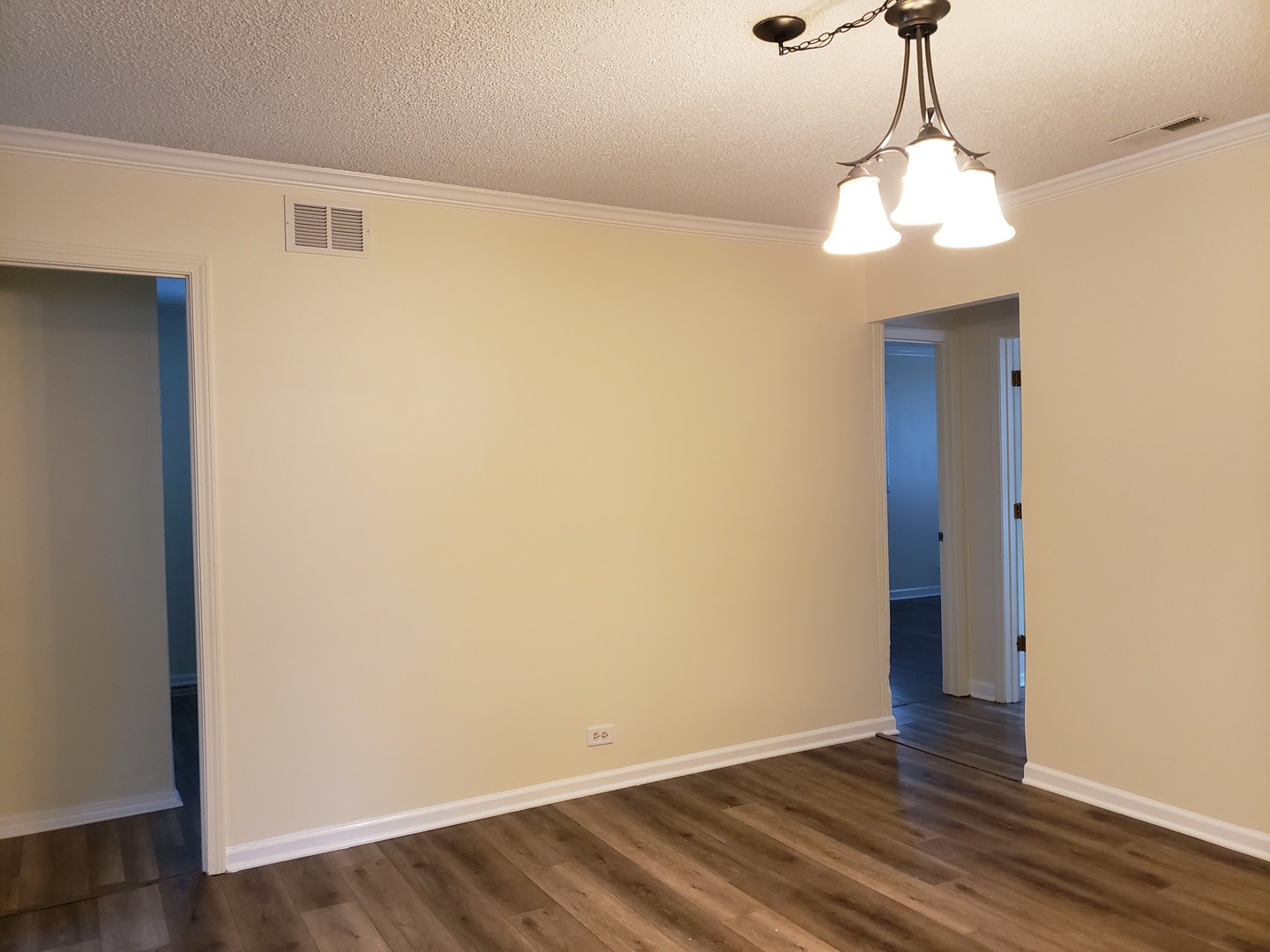 278 Renee Terrace Wheeling, IL 60090 - Photo 5 of 11 a view of an empty room with wooden floor and a window