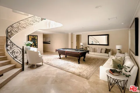 a living room with furniture and a rug