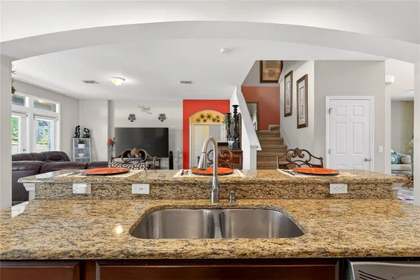 a bedroom with a bed and a potted plant