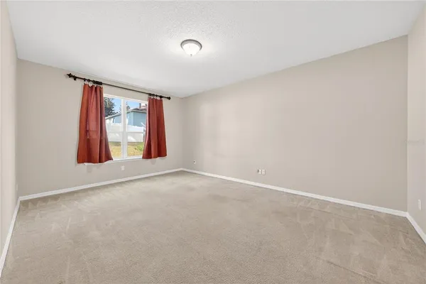 a bedroom with furniture and a book shelf