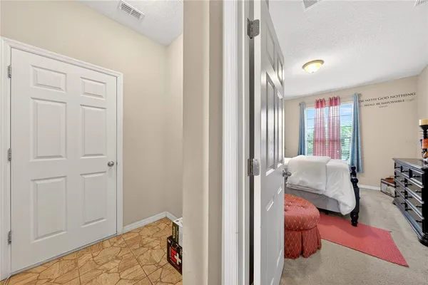 a bedroom with furniture and white walls