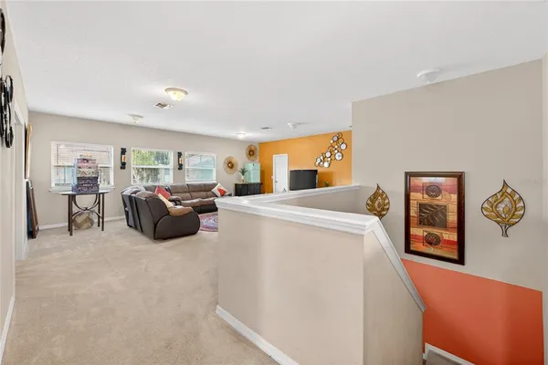 a bathroom with a granite countertop sink toilet and a mirror