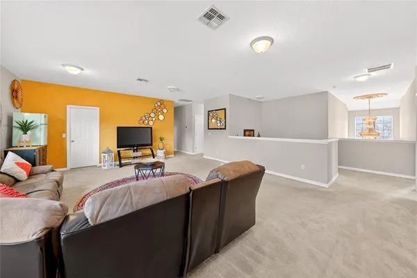a bedroom with a bed and flat screen tv