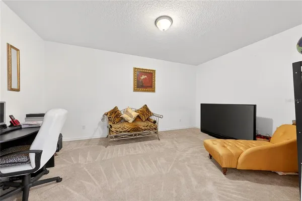 a bathroom with a tub a window and a shower