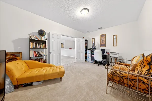 a bath tub sitting in a bathroom next to a window