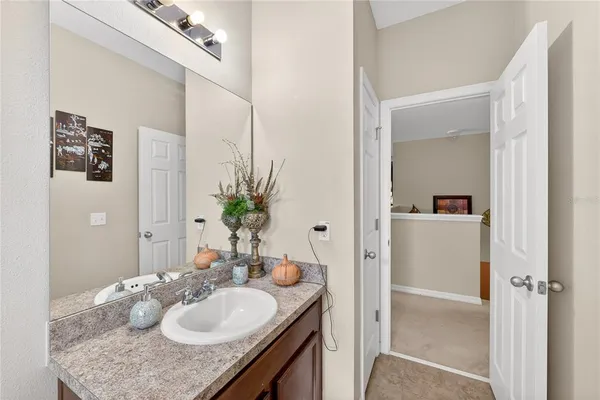 a bathroom with a shower and a sink