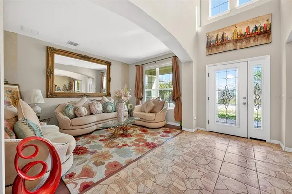 a living room with furniture and a large window