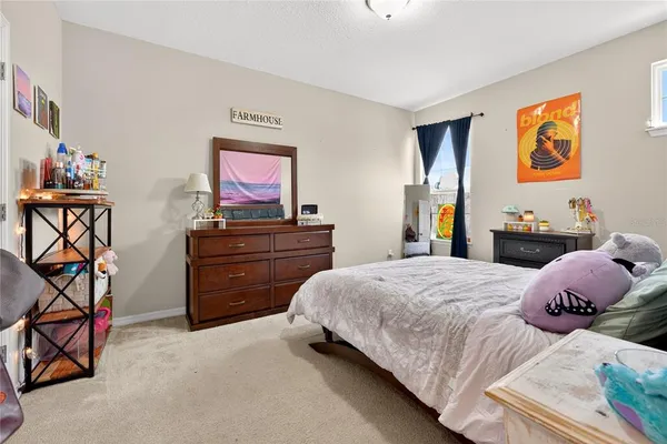 a bedroom with furniture and window