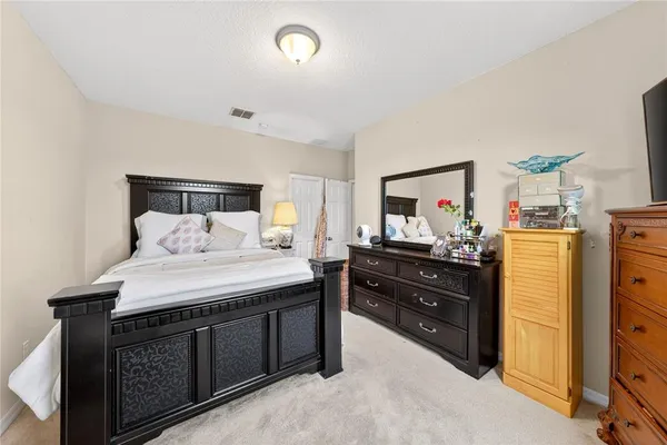 an aerial view of residential houses with outdoor space and ocean view