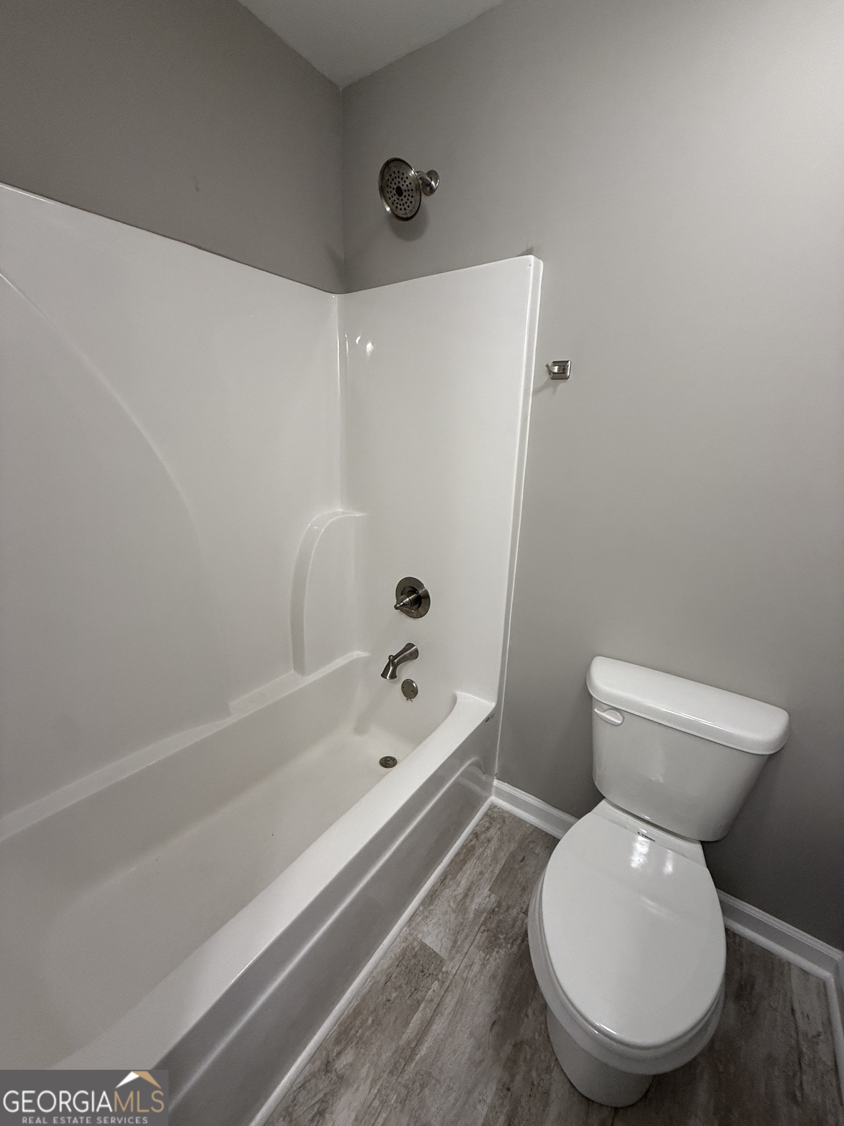 305 Martin Circle Athens, GA 30601 - Photo 12 of 15 a bathroom with a toilet and a bathtub