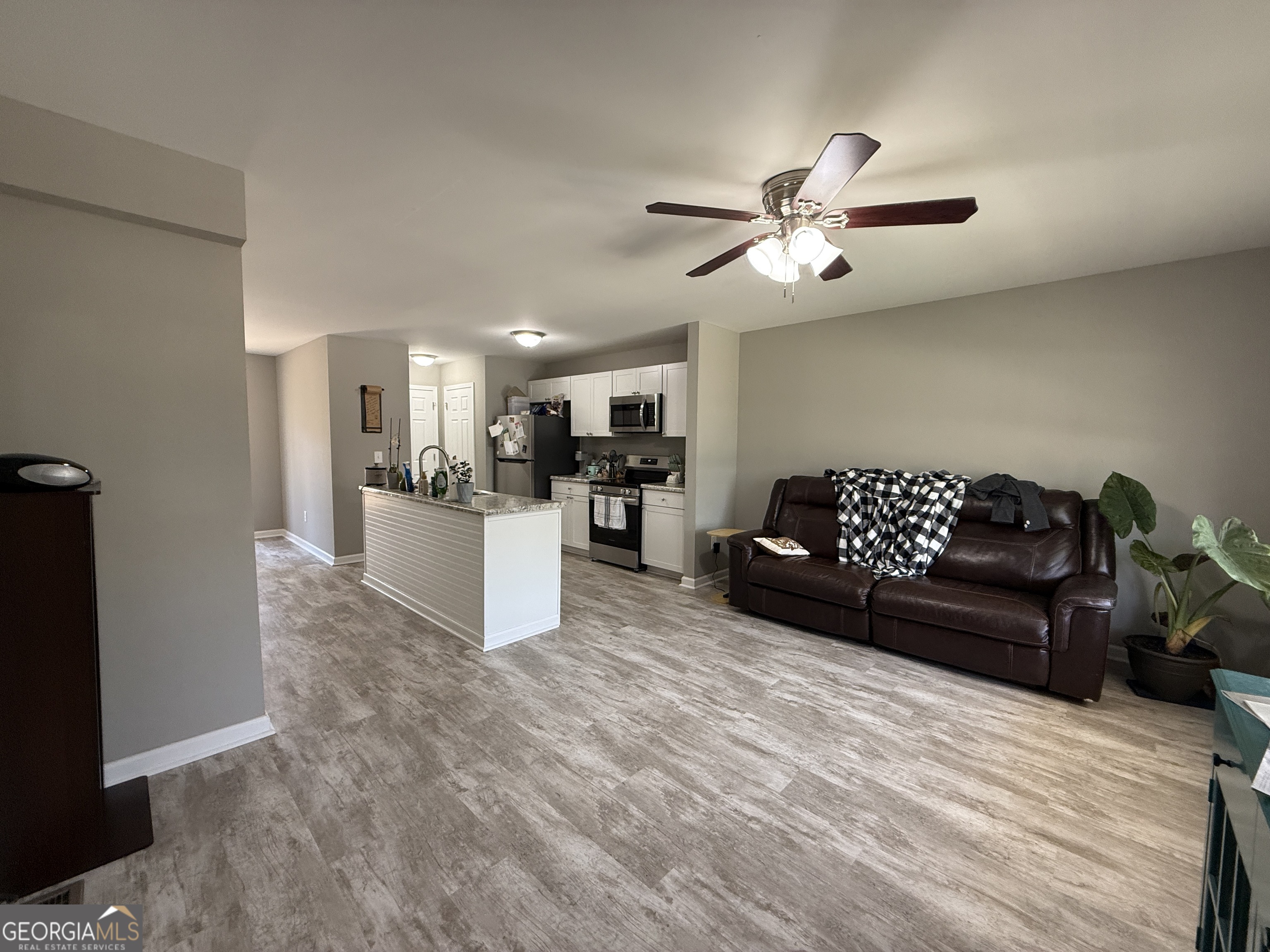 305 Martin Circle Athens, GA 30601 - Photo 2 of 15 a living room with furniture and kitchen view
