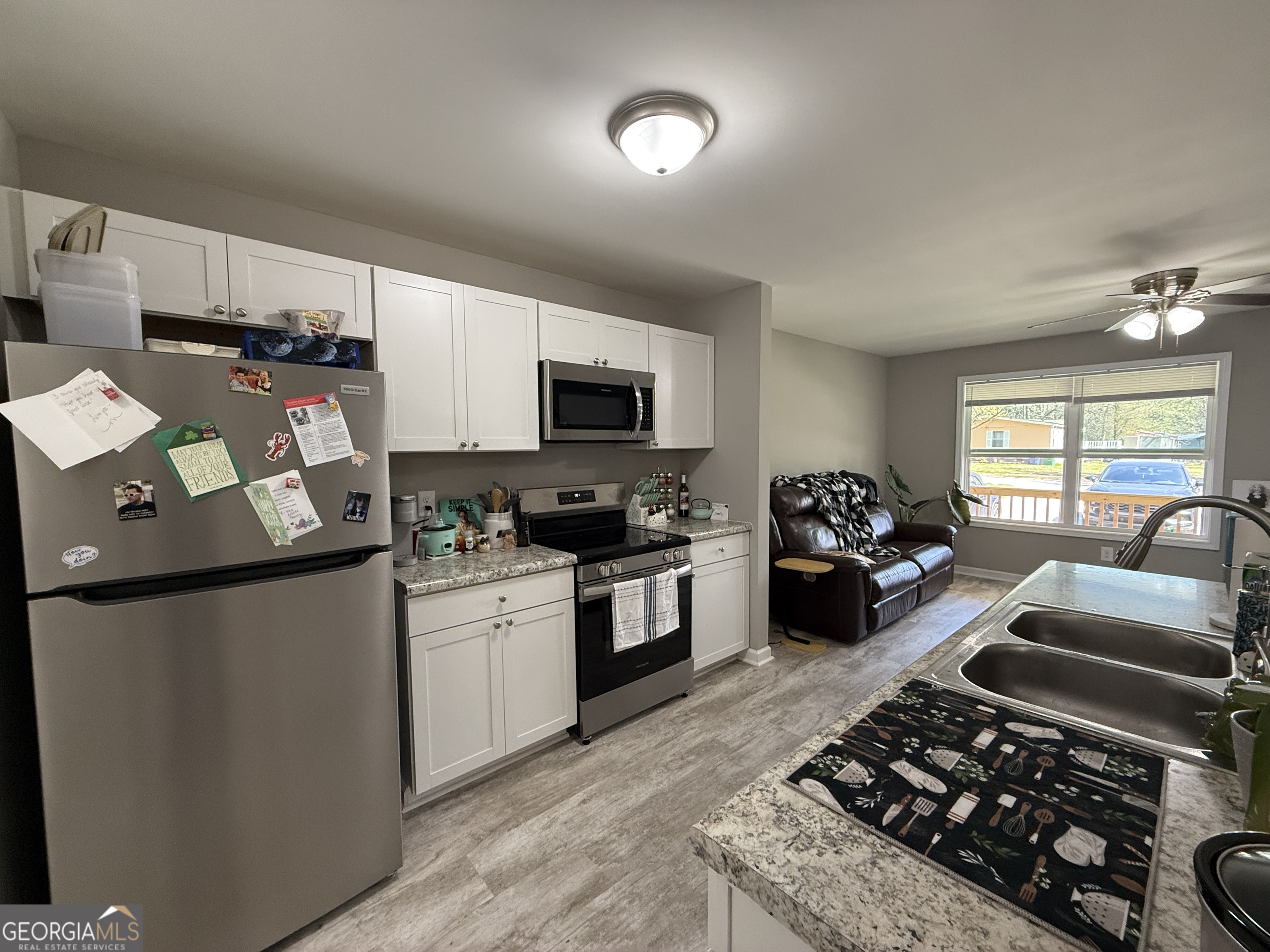305 Martin Circle Athens, GA 30601 - Photo 4 of 15 a kitchen with sink a stove and refrigerator