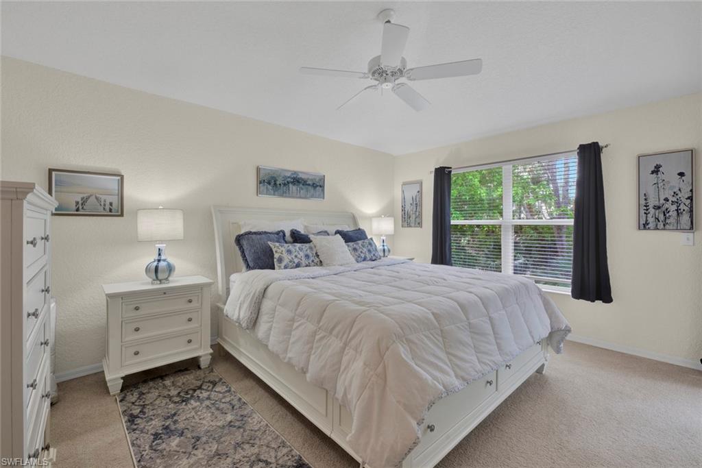 386 Emerald Bay Circle, Unit G4 Naples, FL 34110 - Photo 8 of 20 a bedroom with a bed and a window