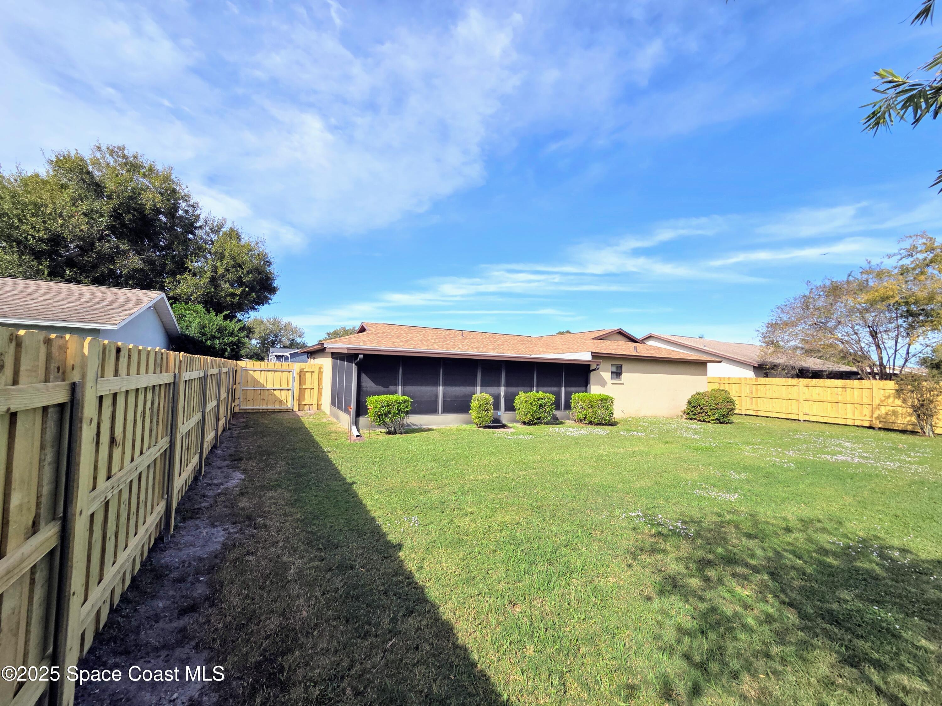 2591 Fulton Court Melbourne, FL 32935 - Photo 24 of 28 a view of a house with backyard and porch