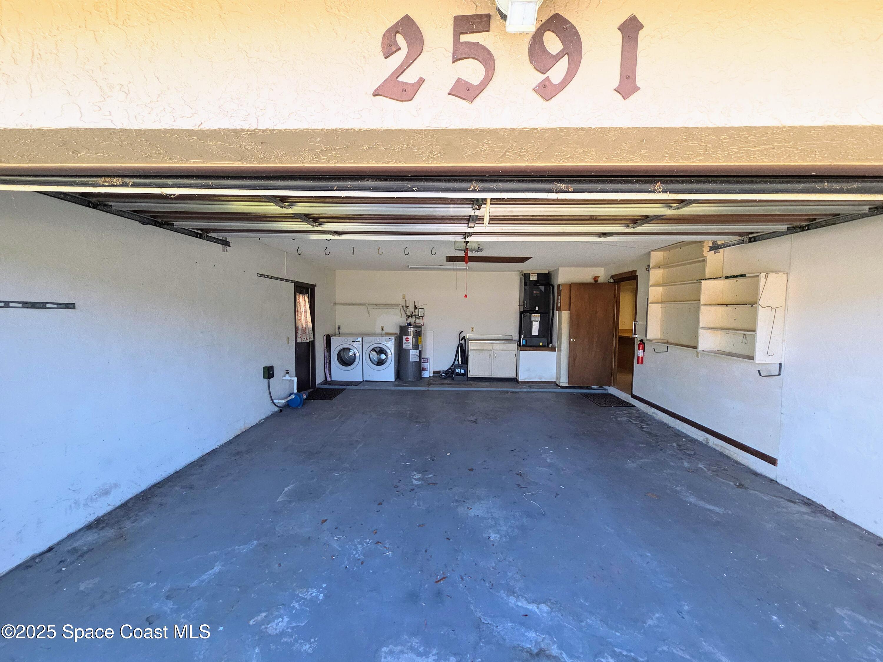2591 Fulton Court Melbourne, FL 32935 - Photo 28 of 28 a view of a garage