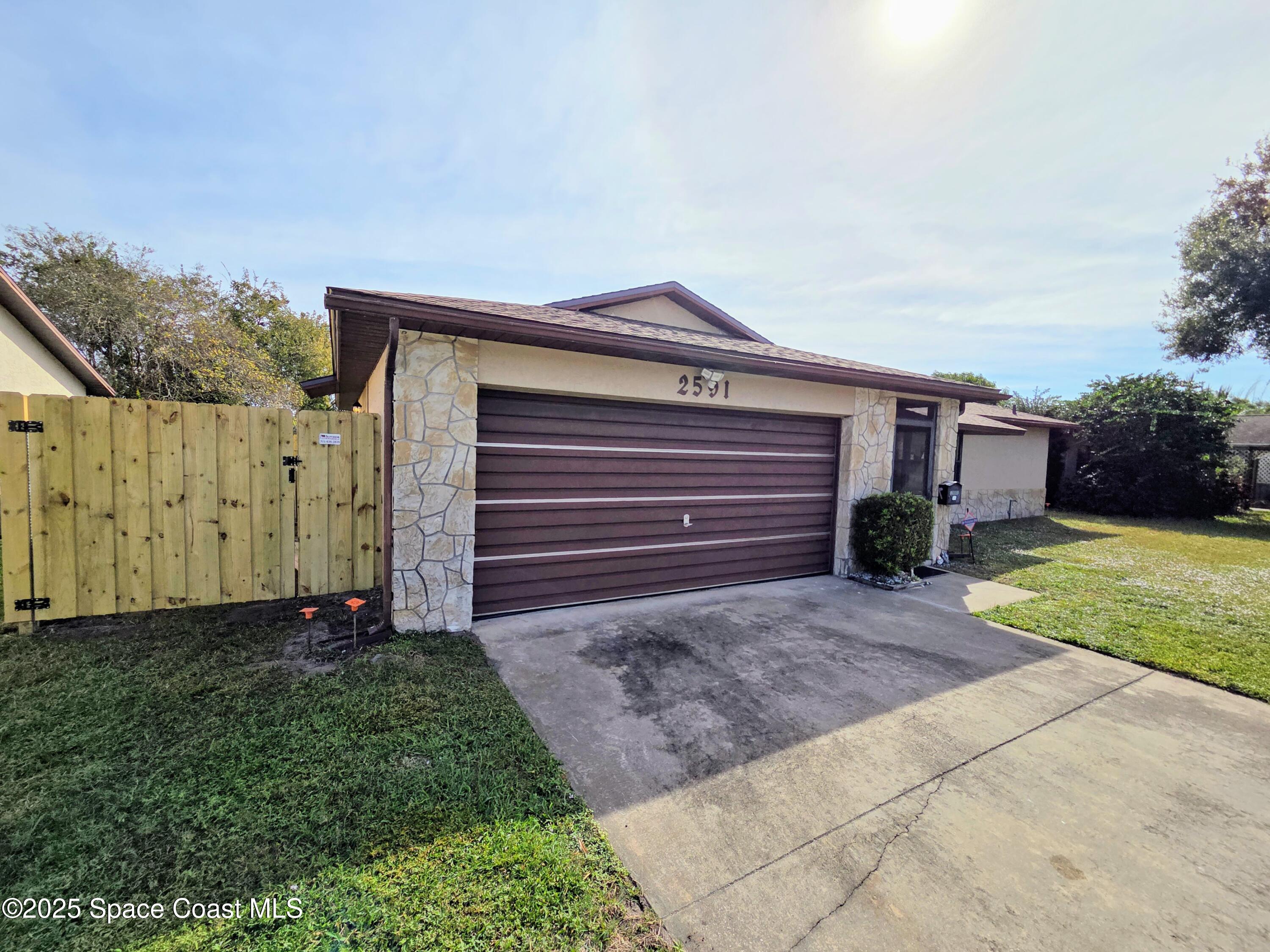 2591 Fulton Court Melbourne, FL 32935 - Photo 3 of 28 a view of a house with a yard