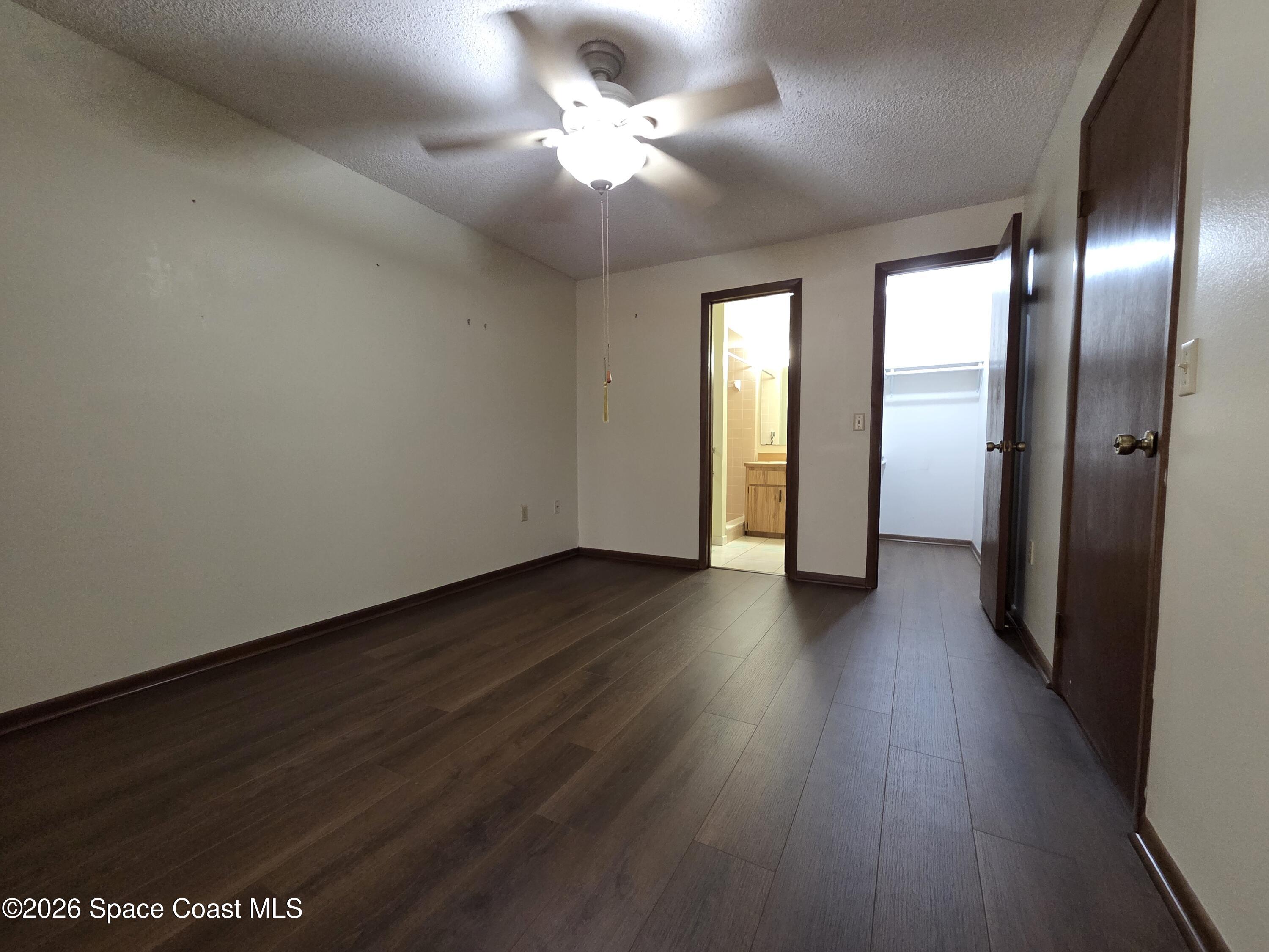2591 Fulton Court Melbourne, FL 32935 - Photo 8 of 28 a view of an empty room with wooden floor
