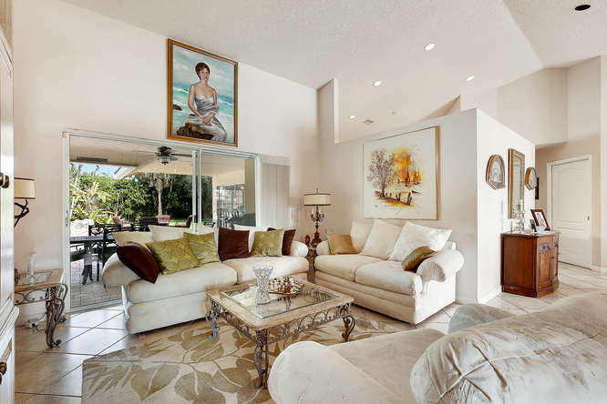 9497 Old Pine Road Boca Raton, FL 33428 - Photo 5 of 31 a living room with furniture and a large window