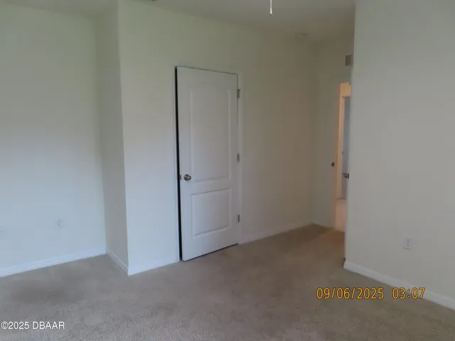 an empty room with closet area