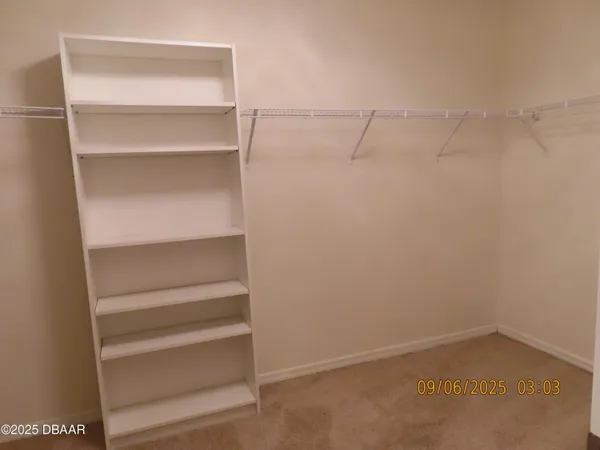 a view of a hallway with closet area