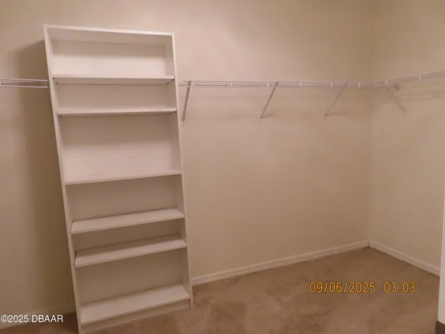 a view of a hallway with closet area