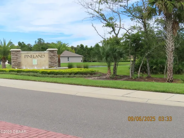 a view of a backyard with fence