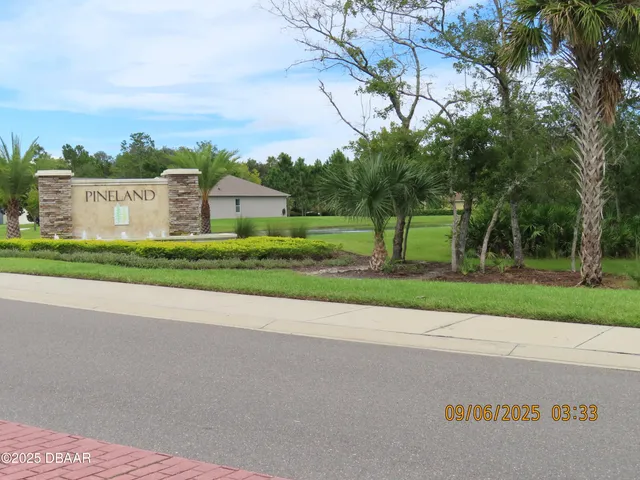 a view of a backyard with fence