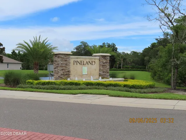 a backyard of a house with plants and garden