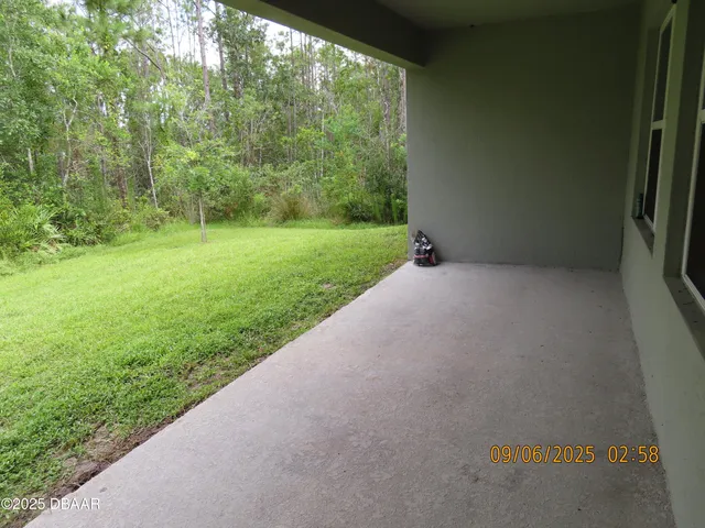 a view of a garden with an outdoor space