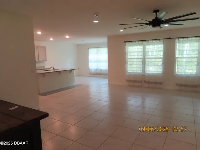 a view of a kitchen with a sink and a window