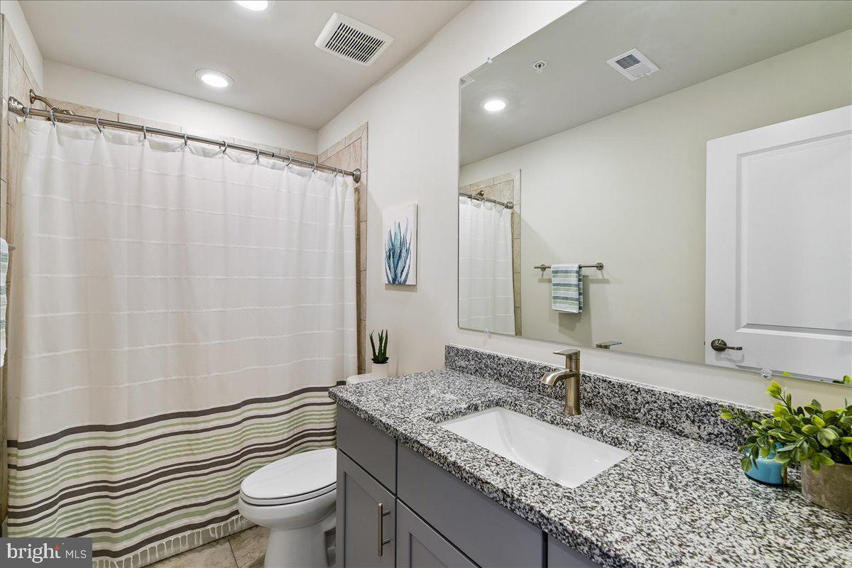 2209 Woodlands Road Windsor Mill, MD 21244 - Photo 33 of 75 HALL BATH W/ TUB SHOWER AND GRANITE COUNTERS