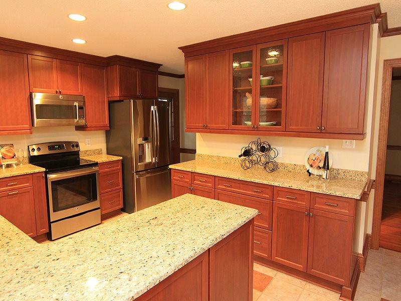 116 Hartland Court Raleigh, NC 27614 - Photo 5 of 25 Looking for a kitchen that allows plenty of working space, loads of cabinets accented with glass doors to show off some of your fun pieces, pantry for additional storage and desk area (not seen). Kitchen