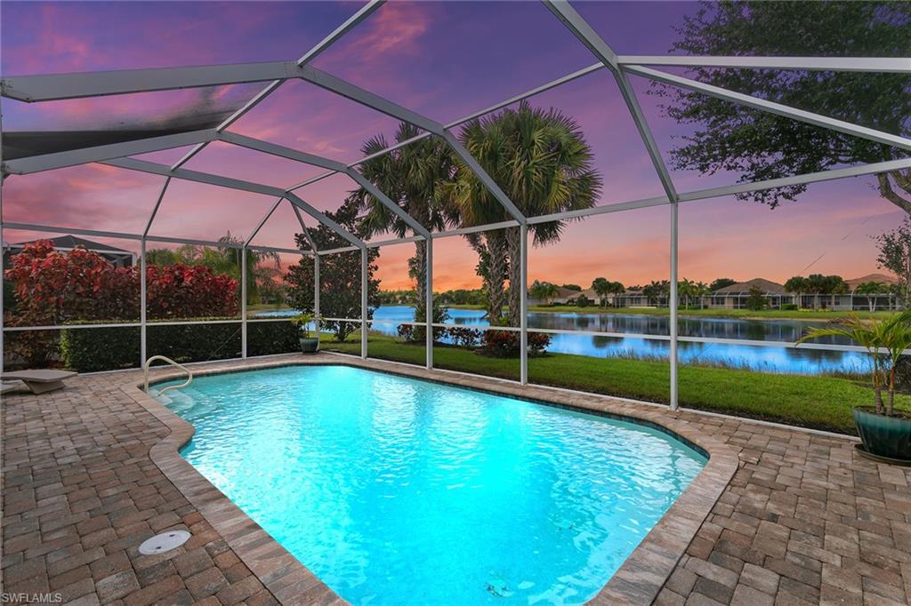 8407 Benelli Court Naples, FL 34114 - Photo 1 of 50 a view of a backyard with a swimming pool