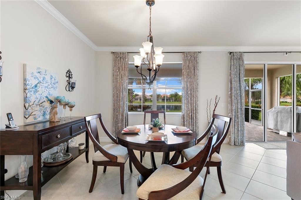 8407 Benelli Court Naples, FL 34114 - Photo 12 of 50 a view of a dining room with furniture window and outside view