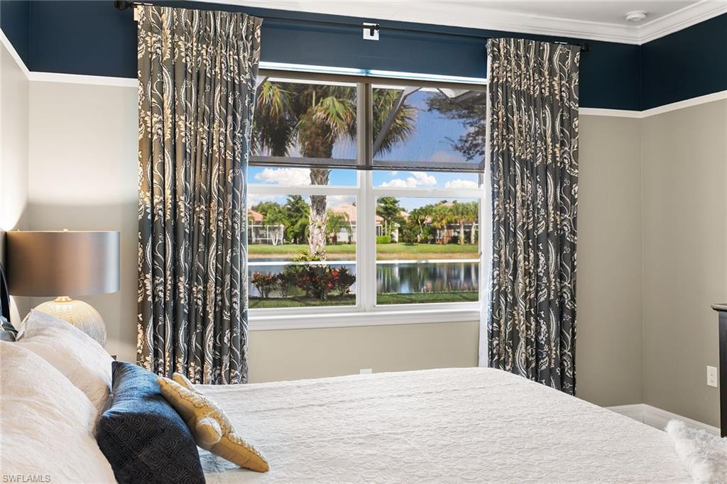 8407 Benelli Court Naples, FL 34114 - Photo 17 of 50 a view of a bedroom with a bed and a window