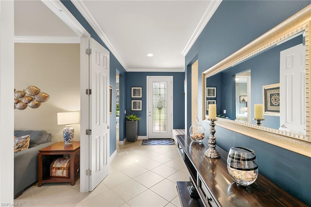 8407 Benelli Court Naples, FL 34114 - Photo 37 of 50 a very nice looking room with a large mirror