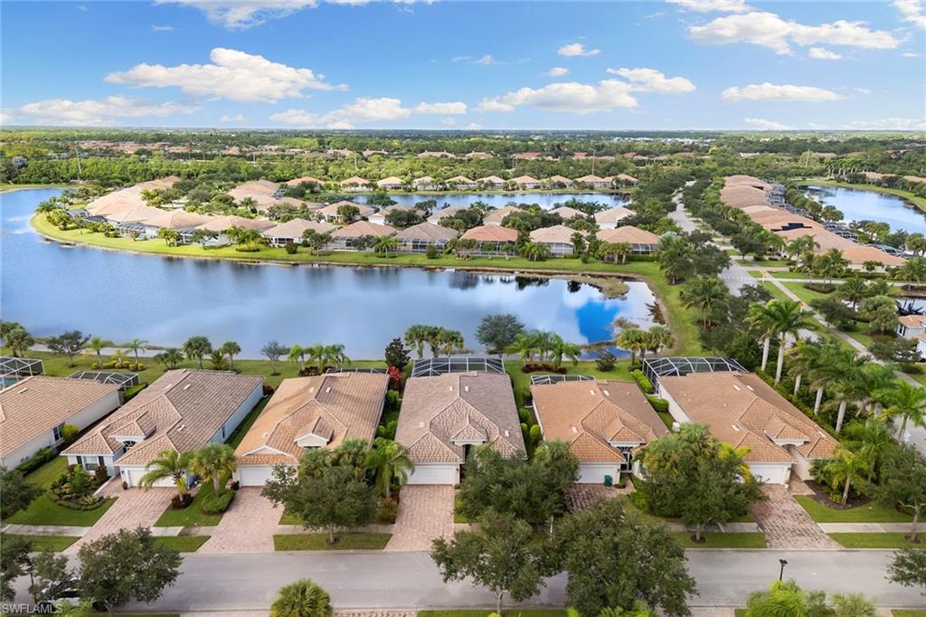 8407 Benelli Court Naples, FL 34114 - Photo 39 of 50 an aerial view of residential houses with outdoor space and ocean view