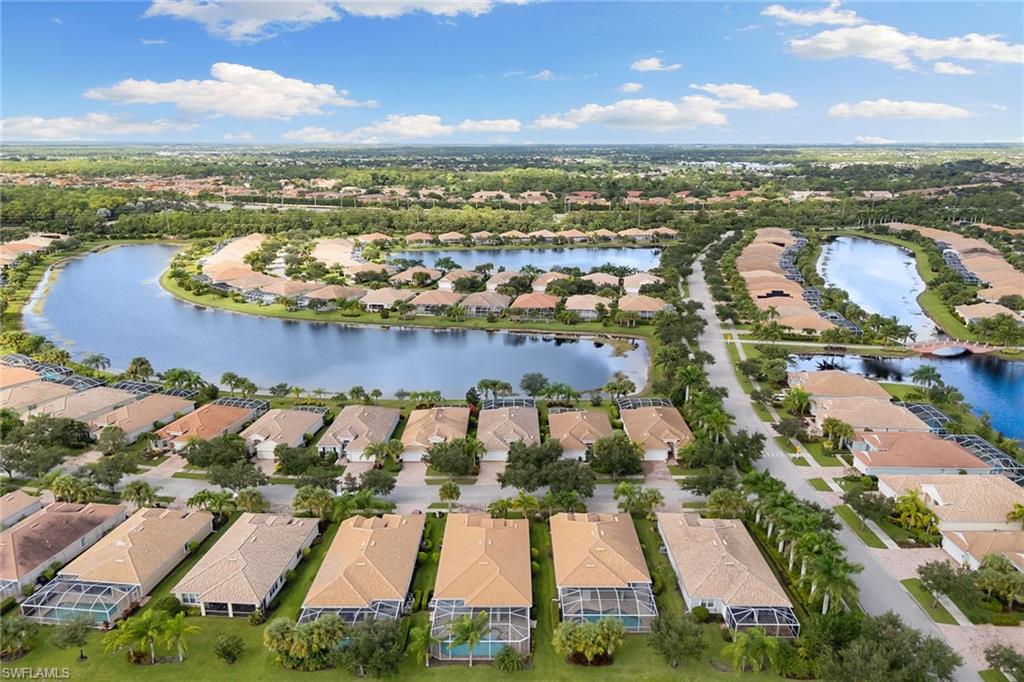 8407 Benelli Court Naples, FL 34114 - Photo 40 of 50 an aerial view of residential houses with outdoor space and swimming pool