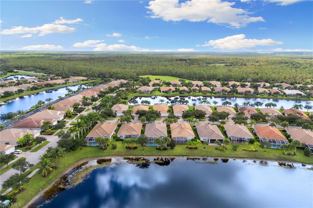 8407 Benelli Court Naples, FL 34114 - Photo 44 of 50 an aerial view of residential houses with outdoor space and ocean view